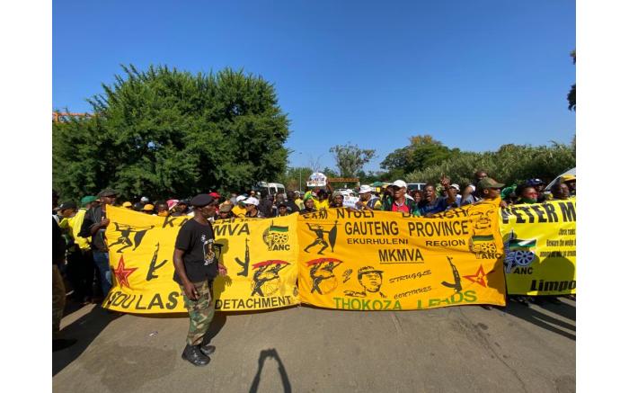 Supporters of ANC secretary-general Ace Magashule gather at Loch Logan Park in Bloemfontein ahead of his court appearance.