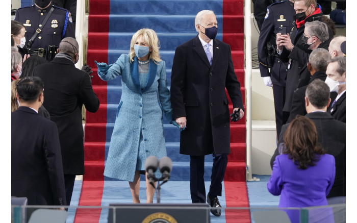 US President-elect Joe Biden flanked by wife Dr Jill Biden arriving for his inauguration.