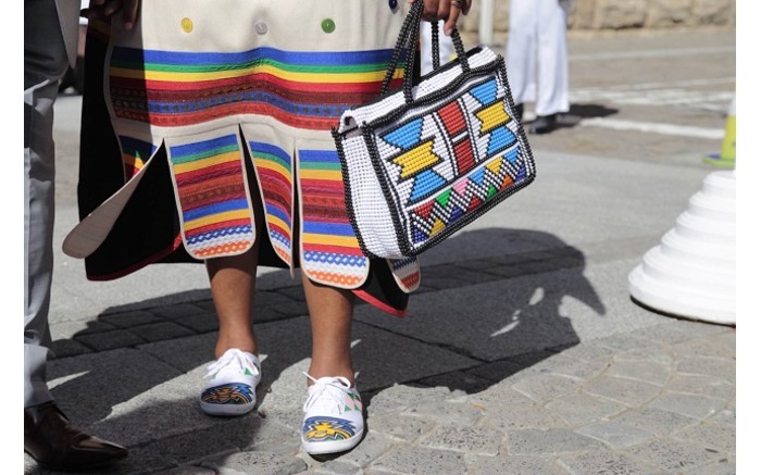 COLOUR BURST: A woman shows off her outfit at Parliament ahead of the start of Sona 2016. Picture: Aletta Harrison/EWN