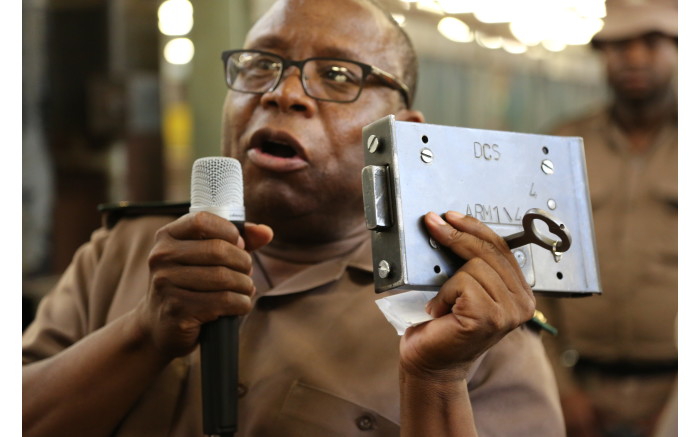 An official shows a lock and key made in the steel workshop of the Kgosi Mampuru II Correctional Centre.