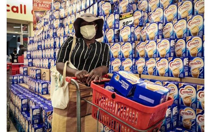 Shopper buys about 10 boxes of Cremora at Shoprite Diepsloot on Black Friday.