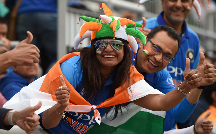 FILE: Indian supporters pose for a photograph in the crowd during the 2019 Cricket World Cup first semi-final between India and New Zealand at Old Trafford in Manchester, north-west England, on 9 July 2019. Picture: AFP